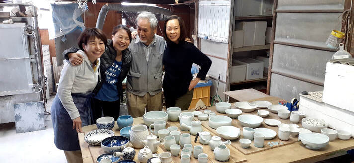 Pottery retreat in Tajimi City, Japan. Two students display their production from their month-long stay at the Ho-Ca studio.